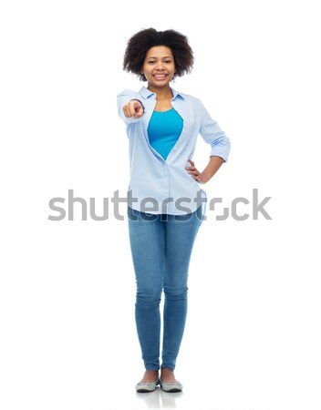 happy african woman pointing finger to you Stock photo © dolgachov