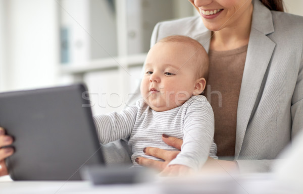 businesswoman with baby and tablet pc at office Stock photo © dolgachov