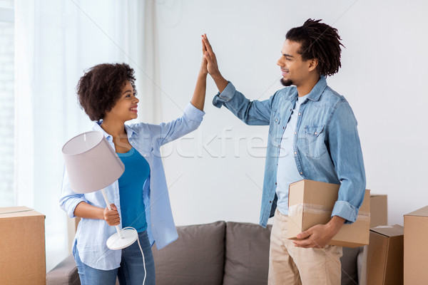 Stock photo: happy couple with stuff moving to new home