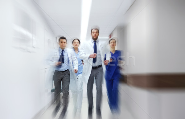 Stock photo: group of medics walking along hospital