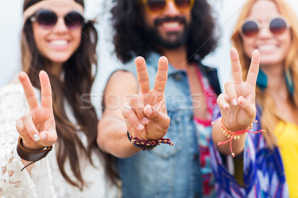 Stock photo: happy young hippie friends showing peace outdoors