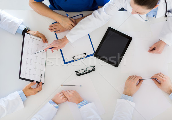 Stock photo: doctors with cardiogram and tablet pc at hospital