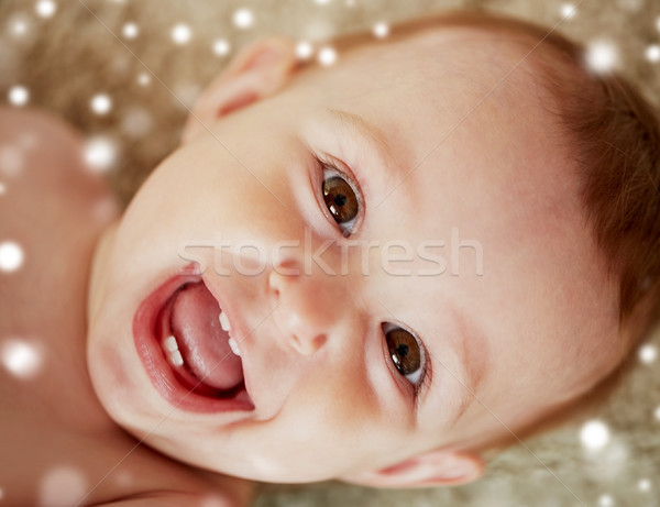 close up of happy little baby boy or girl face Stock photo © dolgachov