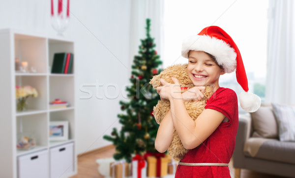 happy girl with teddy bear at christmas Stock photo © dolgachov