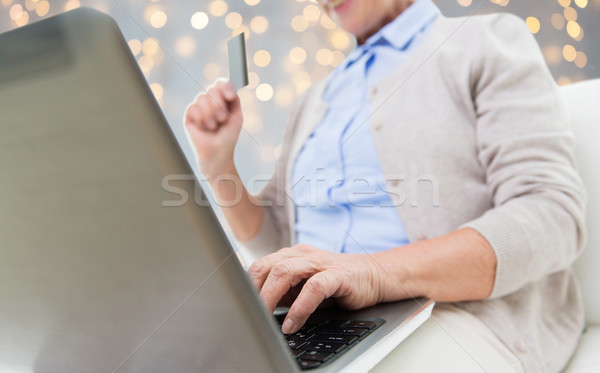 senior woman with laptop and credit card Stock photo © dolgachov
