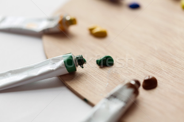 palette and acrylic color tubes or paint Stock photo © dolgachov