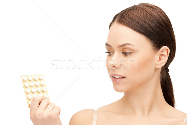young beautiful woman with pills Stock photo © dolgachov
