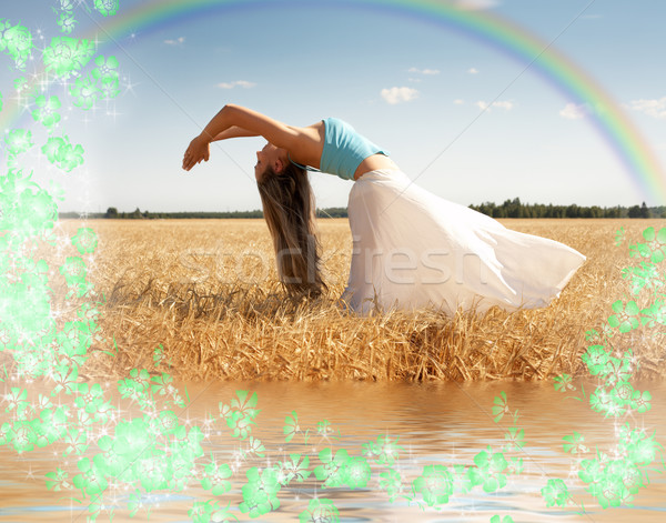 stretching woman with rainbow, water and flowers Stock photo © dolgachov
