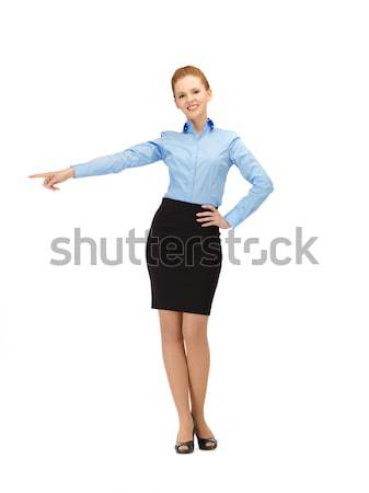 attractive businesswoman pointing her hand Stock photo © dolgachov