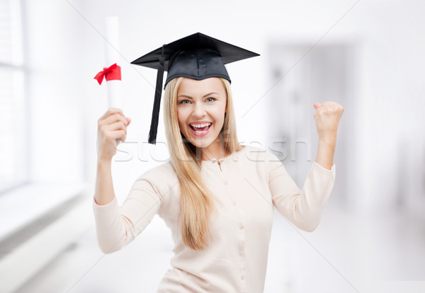 student in graduation cap with certificate Stock photo © dolgachov