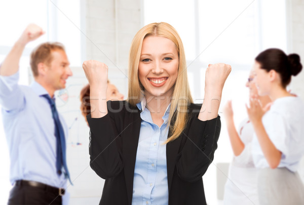 businesswoman celebrating succes in office Stock photo © dolgachov