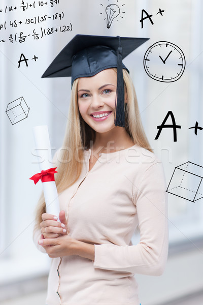 student in graduation cap with certificate Stock photo © dolgachov