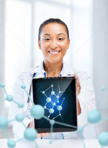 african female doctor with tablet pc and molecules Stock photo © dolgachov