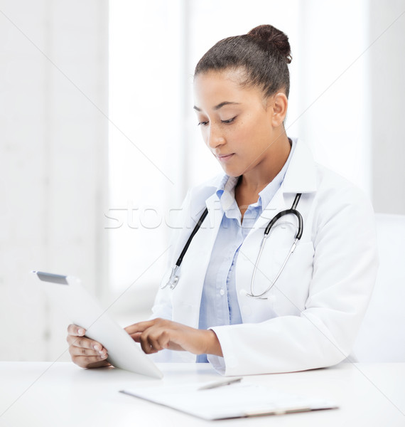 african female doctor with tablet pc Stock photo © dolgachov