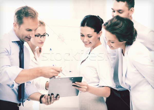 business team discussing something in office Stock photo © dolgachov