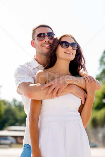 smiling couple in city Stock photo © dolgachov