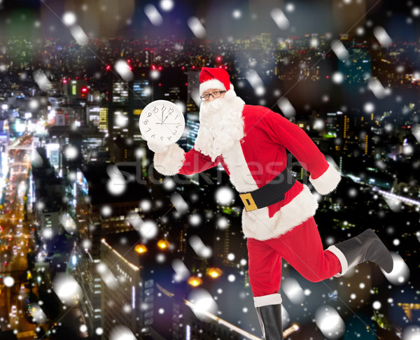 Człowiek kostium Święty mikołaj zegar christmas wakacje Zdjęcia stock © dolgachov