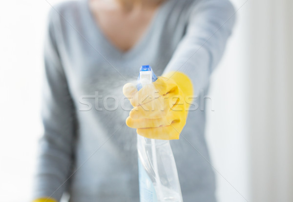 close up of happy woman with cleanser spraying Stock photo © dolgachov