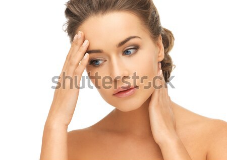 woman holding hands on her neck and forehead Stock photo © dolgachov