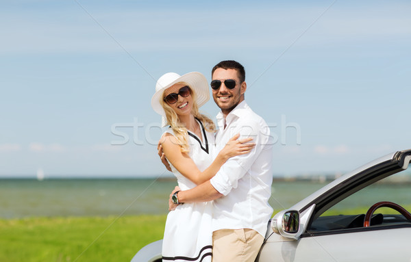 happy man and woman hugging near car at sea Stock photo © dolgachov