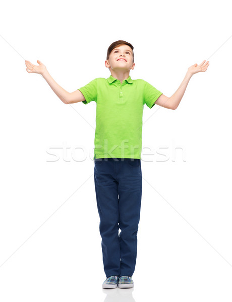happy boy in polo t-shirt raising hands up Stock photo © dolgachov