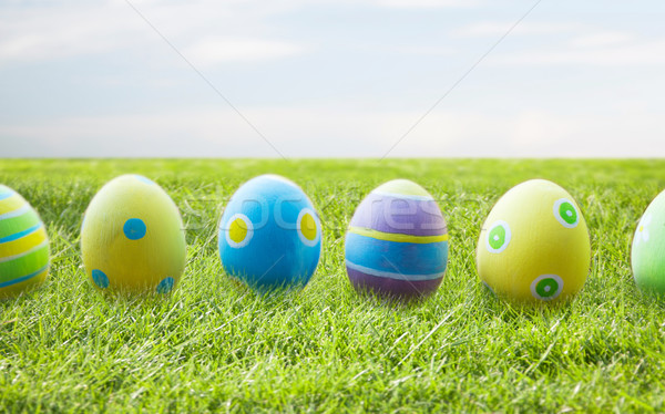 Stock photo: close up of colored easter eggs on wooden surface