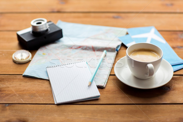 close up of notepad with map and travel tickets Stock photo © dolgachov