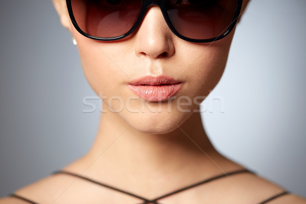 close up of beautiful woman in black sunglasses Stock photo © dolgachov