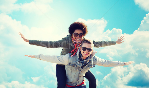 happy teenage couple in shades having fun outdoors Stock photo © dolgachov