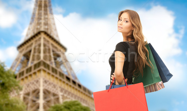 Nő bevásárlótáskák Párizs Eiffel-torony emberek ünnepek Stock fotó © dolgachov