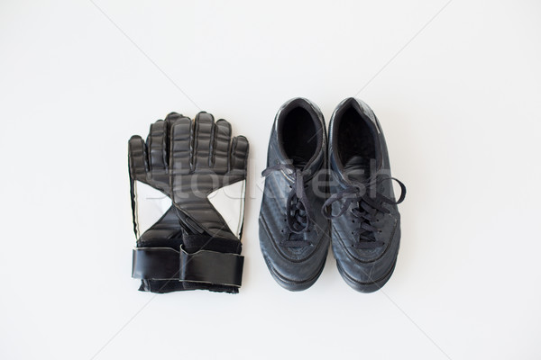 close up of goalkeeper gloves and football boots Stock photo © dolgachov