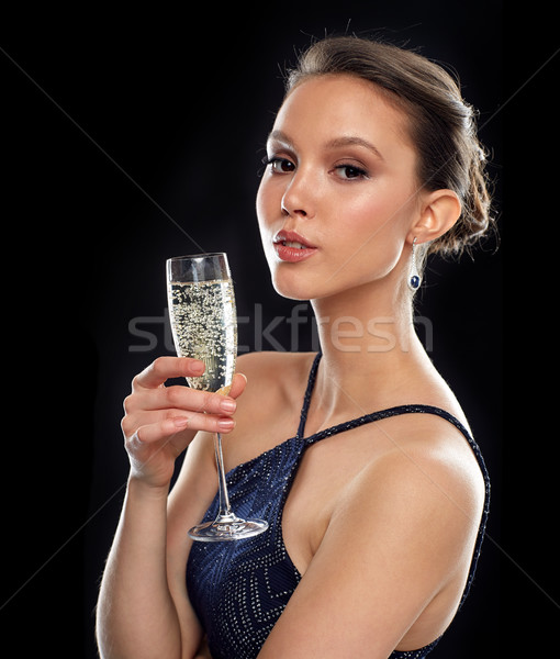 Genç Asya kadın içme şampanya parti Stok fotoğraf © dolgachov