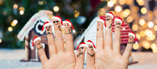 Közelkép ujjak emotikon mikulás sapkák karácsony Stock fotó © dolgachov