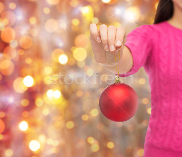 close up of woman in sweater with christmas ball Stock photo © dolgachov