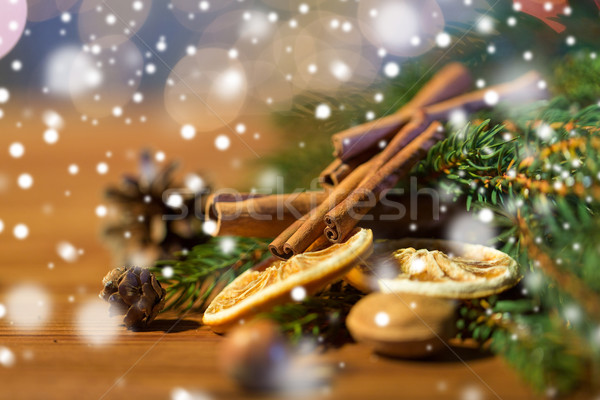 christmas fir branch, cinnamon and dried orange Stock photo © dolgachov