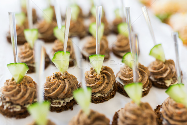 Stock photo: close up of canape with paste on serving tray