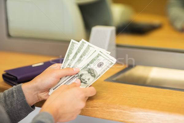 hands with money at bank or currency exchanger Stock photo © dolgachov