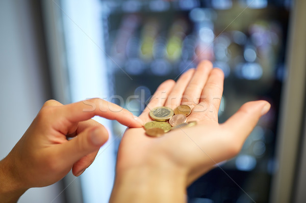 hands counting euro coins at vending machine Stock photo © dolgachov