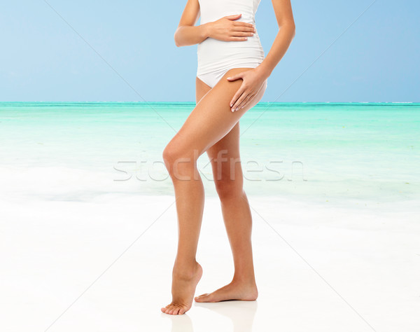 legs of woman in white underwear on beach Stock photo © dolgachov