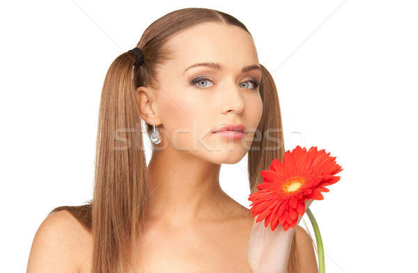 lovely woman with red flower Stock photo © dolgachov