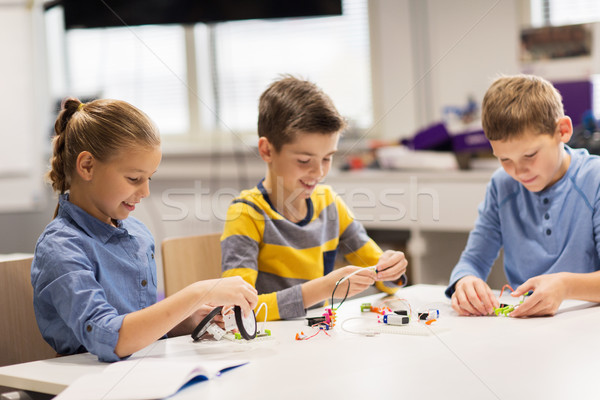 Stock photo: happy children building robots at robotics school