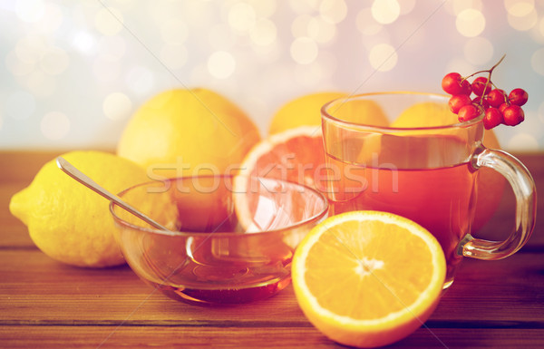 tea with honey, lemon and rowanberry on wood Stock photo © dolgachov