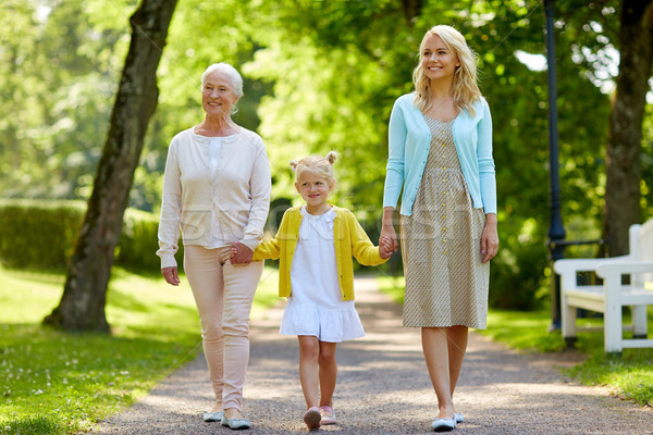 happy mother, daughter and grandmother at park Stock photo © dolgachov