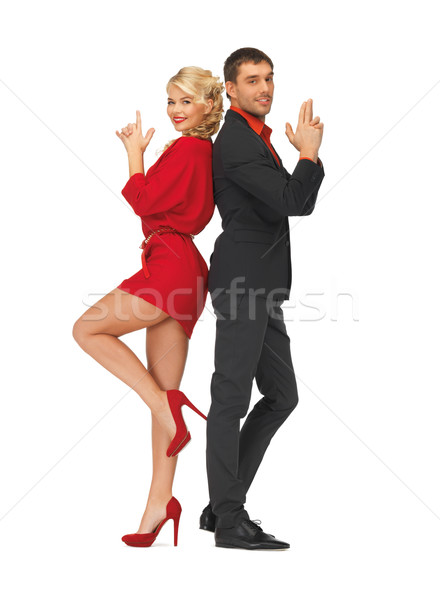 man and woman making a gun gesture Stock photo © dolgachov