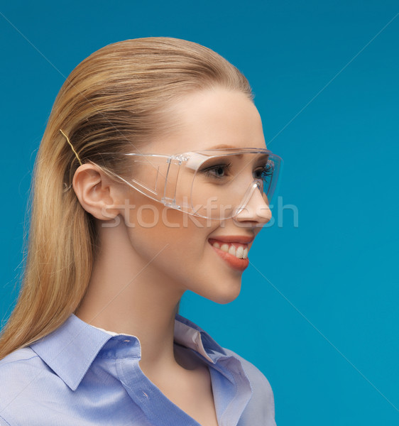 businesswoman in protective glasses Stock photo © dolgachov