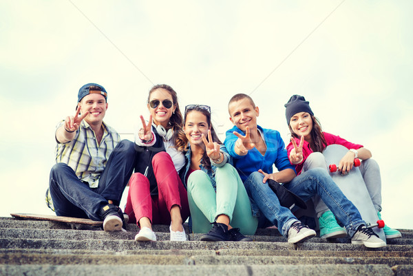 Stock photo: group of teenagers showing finger five