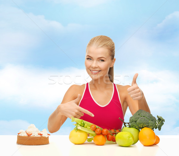 woman pointing at healthy food Stock photo © dolgachov