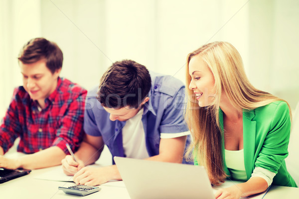 students writing test or exam in lecture at school Stock photo © dolgachov