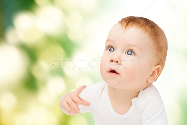 Stock photo: curious baby looking up