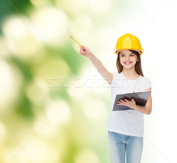 smiling little girl in hardhat with clipboard Stock photo © dolgachov